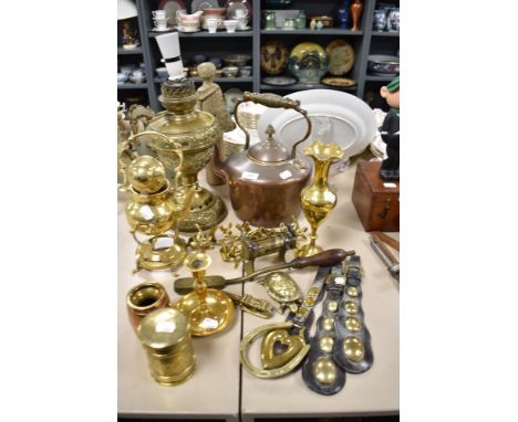 A selection of brass and copper, including copper kettle, nut crackers, candlestick and more.