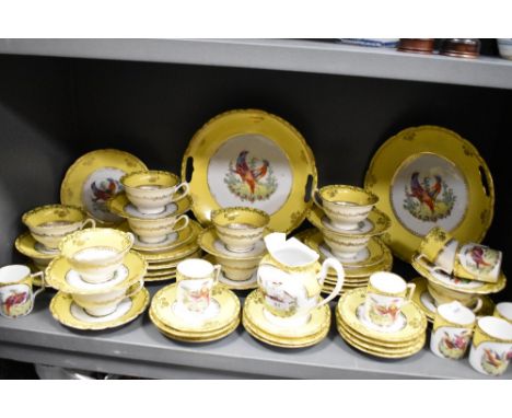 A large collection of 20th century yellow and white table wear having Chelsea style bird design and gilt relief, coffee cans,