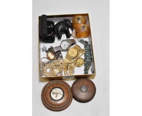 A miscellany of items to included two vintage treen boxes and an elephant, scarf ring, watches and bracelet etc.