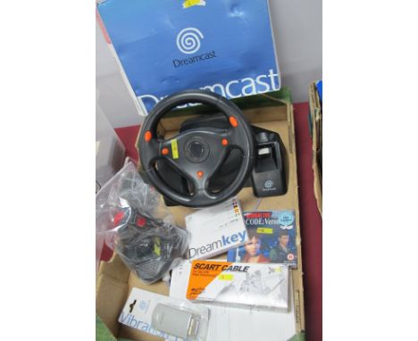 A Boxed Sega Dreamcast Gaming Console, one controller, vibration pack, race controller, quick shot joystick, Resident Evil Co
