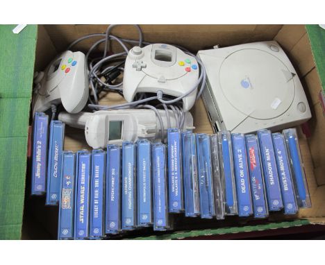 A Unboxed Sega Dreamcast Gaming Console, light gun, two controllers (untested sold for parts only), together with a quantity 