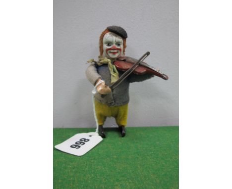 A Circa 1930's Schuco Wind Up Clown, playing a violin, (no key), untested, signs of wear.