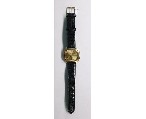 Gent's 9ct gold Rotary wristwatch with rounded oblong dial, baton numerals, side button and the black leather strap 
