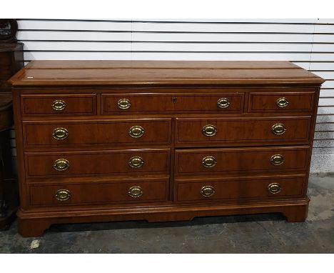 20th century yew chest of drawers, the rectangular top with canted corners, fluted pilasters, seven assorted drawers, the who