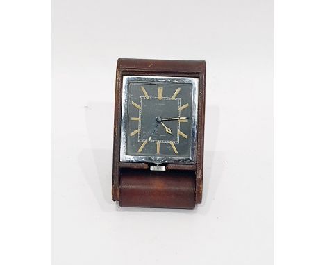 Le Coultre for Asprey eight-day travel clock, the black ground dial with arrow-shaped numerals, the whole fitted in a brown l