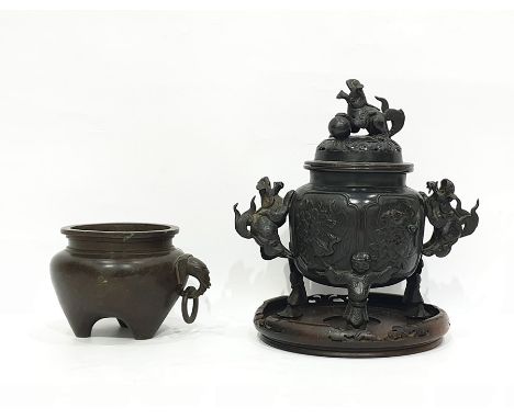 Chinese bronze censer, of circular form, decorated with landscape panels, with pierced cover, the knop and handles modelled a