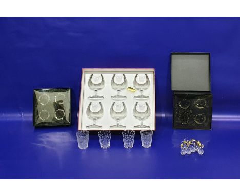 Set of six Baccarat boxed brandy balloons, four boxed Orrefors glass shot glasses, two with interlocked etched ring design, t