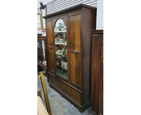 Late 19th/early 20th century wardrobe with single arched top mirror and central drawer, above two short drawers, bracket feet