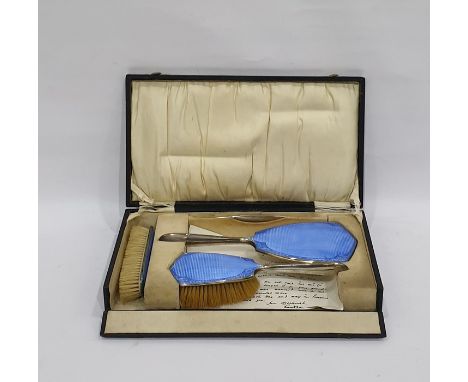 Silver and enamel three-piece dressing table set decorated with engine-turned and floral blue enamel panels, comprising two b