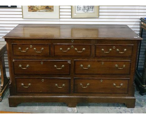George III style oak and mahogany cross-banded North Country mule chest, the lift top with moulded edge above two banks of tw