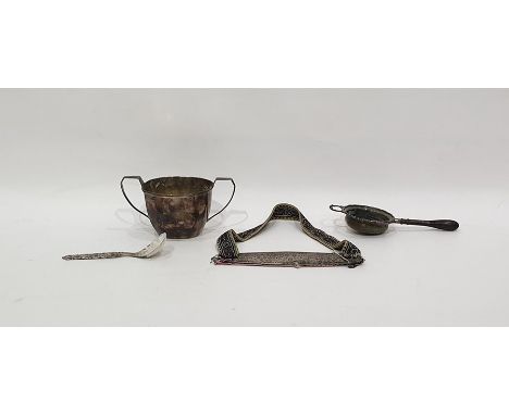 Silver two-handled sugar bowl, Birmingham 1933, of panelled form, a silver tea strainer with turned wooden handle, a Norwegia