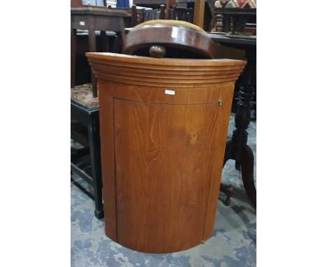 Contemporary polished wood small bowfronted corner cupboard with stepped cornice and a circular walnut-framed stool raised up