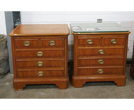 Pair of 20th century yew bedside chests, the rectangular tops with canted corners, above two short and three long drawers, to