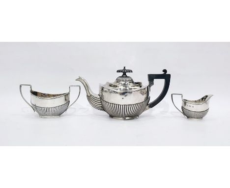 Edwardian silver bachelor's three-piece teaset by Marston & Bayliss, Birmingham 1901, of half-fluted oval form, comprising te