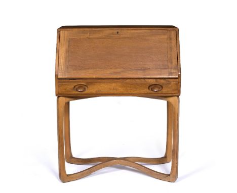 Ercol Bureau, the fall front over single drawer, all raised over carved supports joined by 'X' shape base, 104cm high x 81cm 