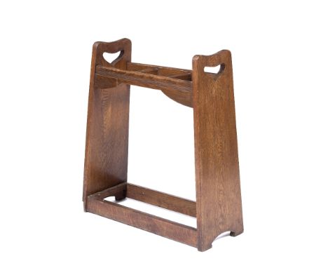 Manner of Liberty & Co Oak stick stand, with heart-shaped cut-outs to each end, 77cm high, 58cm wide