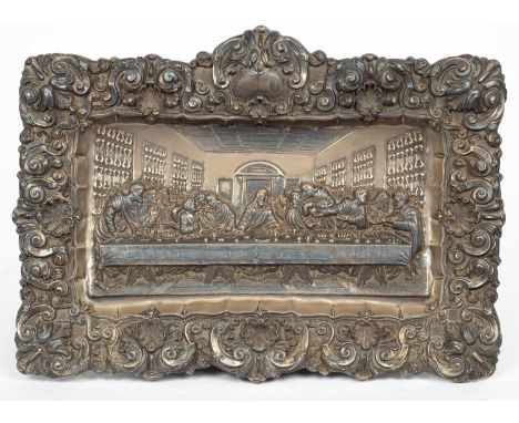 A Continental white metal panel of the last supper, in foliate scroll border, unmarked, 46cm x 60cm, a silver plated entrée d