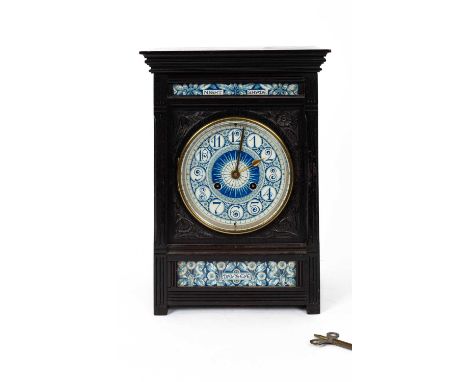 Lewis Foreman Day (1845-1910) An Arts and Crafts porcelain mounted ebonised mantel clock, made and retailed by Howell and Jam