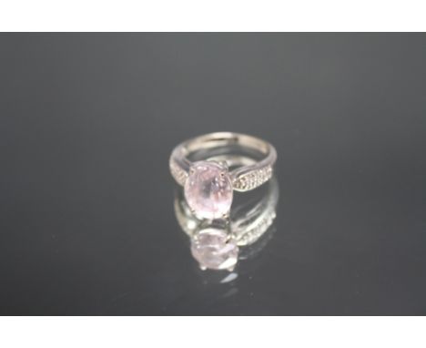 A HALLMARKED 9 CARAT WHITE GOLD RING, set with a large oval pink stone, approx weight 3.7 g, ring size N 1/2