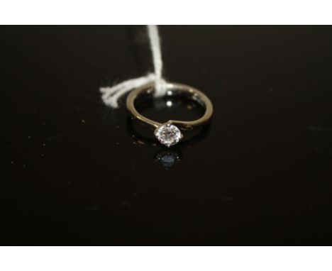 A PLATINUM DIAMOND SOLITAIRE RING, having a brilliant cut diamond of an estimated half a carat, approx weight 3.9g, ring size