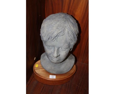 A CERAMIC HEAD BUST