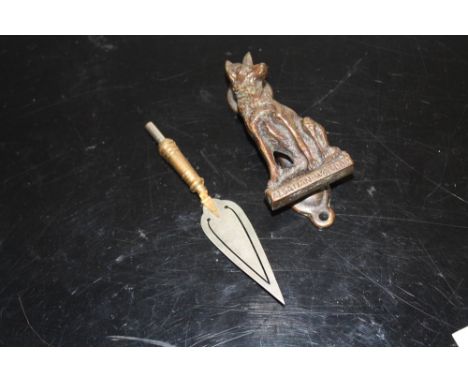 A NOVELTY TROWEL SHAPED BOOK MARK TOGETHER WITH AN ALSATIAN DOOR KNOCKER