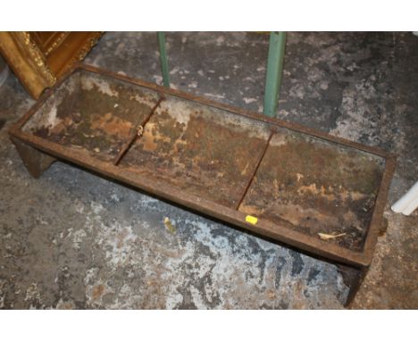 A VINTAGE METAL TROUGH