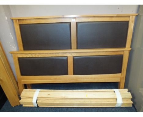 A MODERN LIGHT OAK AND UPHOLSTERED KING SIZE BED FRAME