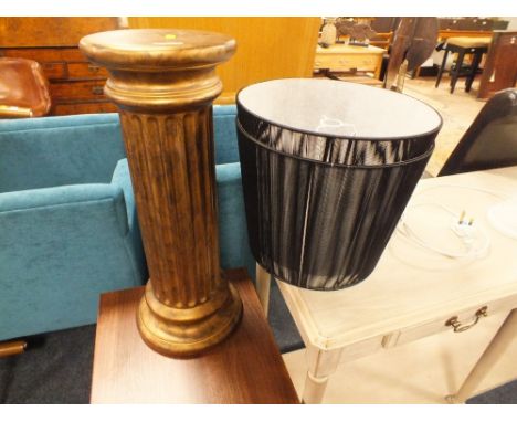 A CERAMIC PLINTH AND TWO BLACK LAMP SHADES (3)