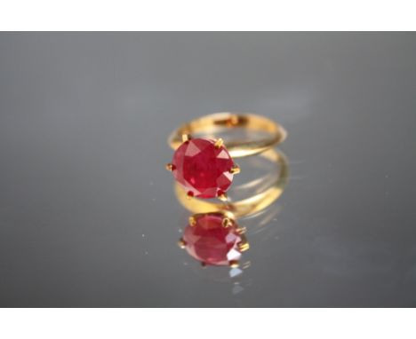 A HALLMARKED 9 CARAT GOLD RUBY SOLITAIRE RING, in high gallery setting, the ruby being an estimated 3 carats