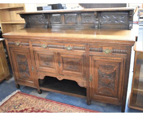 An Edwardian Carved Oak Sideboard/Buffet with Three Drawers Over Cupboard base, Raised Galleried Shelf, 182cm Wide 