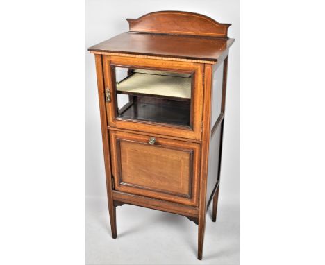 An Inlaid Edwardian Mahogany Music Cabinet with Pull Front Having Three Section Interior, Glazed Top with Single Shelf, Raise