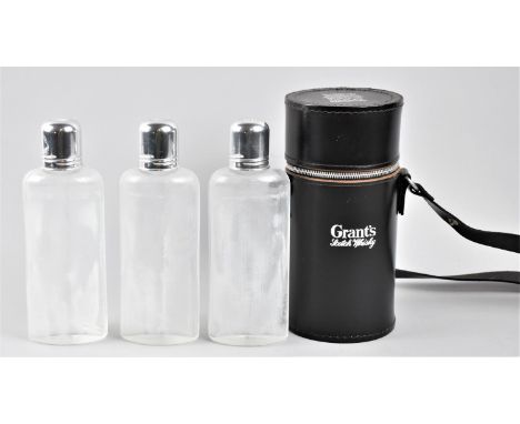 A Modern Leather Case for Grant's Scotch Whisky Containing Three Glass Flasks with Silver Plated Tops, 20cm high 