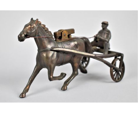 A Novelty Lighter In the Form of a Bronze Effect Trotting Horse and Sulky, One Wheel AF (We are Unable to Post this Lot), 14c