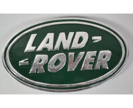 A Reproduction Aluminum Oval Land Rover Plaque, 30cm wide 