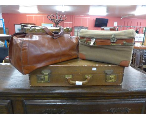 A leather Gladstone bag, leather suitcase and cased leather travel trunk