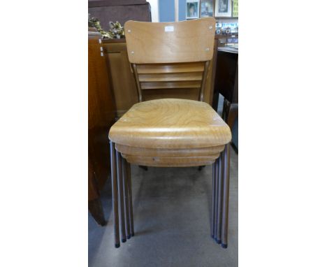 A set of four vintage stacking chairs