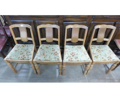 A set of four light oak chairs