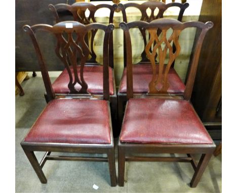 A set of four Chippendale Revival mahogany dining chairs