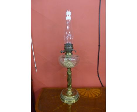 A Victorian brass and glass oil lamp