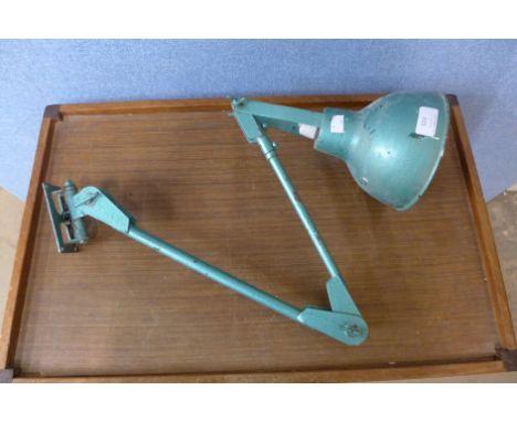 A wall mounted industrial anglepoise lamp