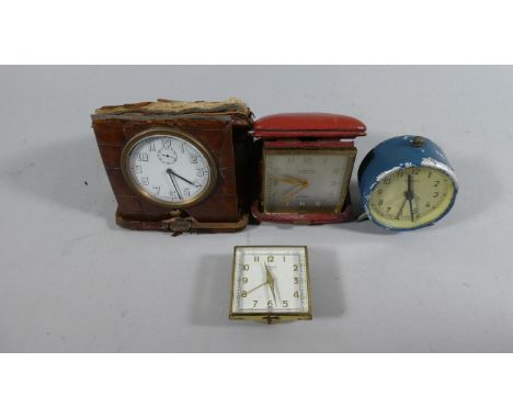 A Nice Quality Crocodile Case Mounted Swiss Mounted Travelling Clock Together with Three Other Examples, All in Need of Resto
