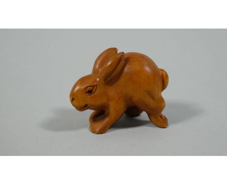 A Carved Wooden Netsuke in the form of a Hare, 3.5cm