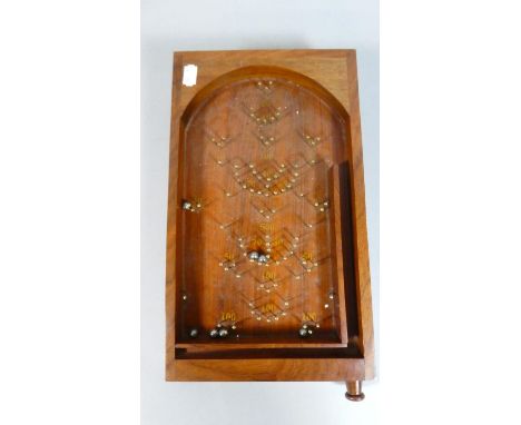 A Mahogany Reproduction Bagatelle Game, 20x35cm 
