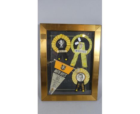 A Cased Diorama Containing Wolves Rosettes, Wolves Pennant For the FA Cup Winners 1892-93, 1907-1908, 1848-49, 1959-60, Leagu