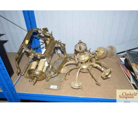A hanging glazed brass light fitting and other light fittings