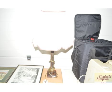 A metal column light with shade