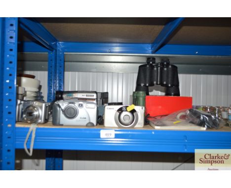 A pair of Halina 20 x 50 binoculars and another pair of binoculars; a Panasonic video recorder and a quantity of cameras etc