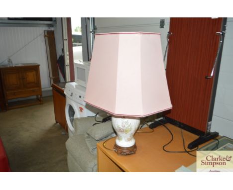 A china table lamp with large pink shade