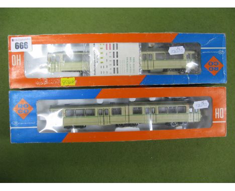 Two Roco "HO" Gauge Ref. 8500 Articulated (Two Section) Electric Trams, with fitted pantograph green/cream livery, supplied w